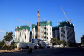 A housing project in HCM City. The State will regulate the market if property price rise by 20 per cent for three months. (Photo: VNA)