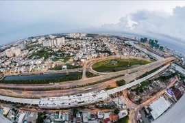 A view of HCM City's District 2 with Hanoi Highway and Metro Line 1 Ben Thanh - Suoi Tien. District 2 is undergoing development to emerge as a financial hub. (Photo: VNA)