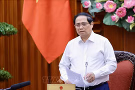 PM Pham Minh Chinh speaks at the meeting between permanent Government members and representatives of ministries and sectors on August 16. (Photo: VNA)