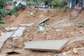 A road in Chi Lang ward of Lang Son city, Lang Son province, is eroded due to heavy rains on July 29 - 30. (Source: VNA)