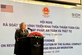 IOM Chief of Mission Kendra Rinas speaks at the conference in Hanoi on December 18. (Photo: VNA)