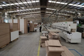 Wooden goods are made for export at a factory in Long An province. (Photo: VNA)