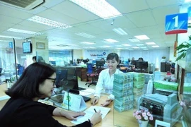 Reference exchange rate up 27 VND