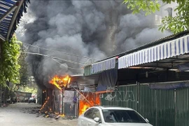 Five cars, 19 motorbikes burned at Hanoi parking area