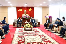 At the working session (Photo: VNA)