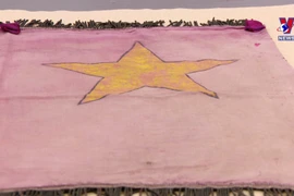 National flag crafted by OVs in Paris on first National Independence Day