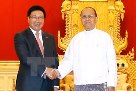 Deputy Prime Minister and Foreign Minister Pham Binh Minh (L) and Myanmar President Thein Sein (Photo: VNA)