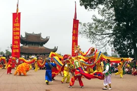 Artists perform a dragon dance at the Do Temple Festival.