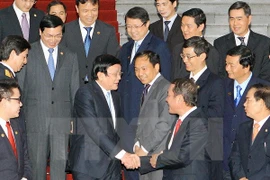 President Truong Tan Sang met with representatives of the 63 businesses winning the Vietnam National Trademark Award 2014 (Photo: VNA)