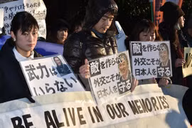 Japanese people in a silent march in Tokyo to protest the barbaric acts. Photo: AFP/VNA.