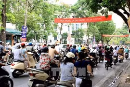 Anti-smoking banners hung in Hanoi streets. Photo: VNA