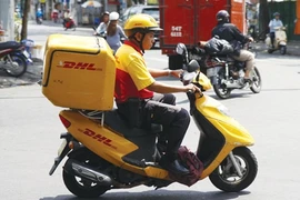 DHL-VNPT, which holds the second largest domestic market share, has invested US$10 million to further expand its market, including the purchase of modern equipment and the opening of more delivery centres in large cities. (Photo: Vnpost)