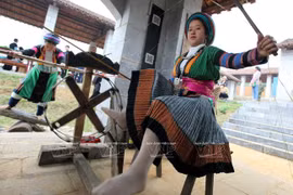 Every young Mong ethnic girl is good at sewing their traditional colourful costumes. (Photo: VNA)