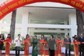 Vice Chairwoman of the National Assembly Nguyen Thi Kim Ngan (five from left) and other city's representatives cut the ribbon to inaugurate the cancer centre (Photo: VNA)