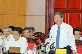 Minister of Natural Resources and Environment Nguyen Minh Quang at the Q&A session. Photo: VNA