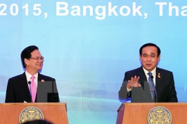 Prime Minister Nguyen Tan Dung (L) and his Thai counterpart Prayuth Chan-ocha at the press conference. (Photo: VNA)