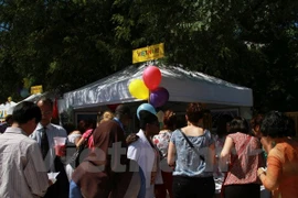 Vietnam's booth drew attention of international friends. (Photo: VNA)