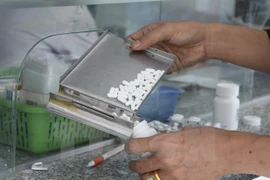ARV pills are prepared to be given to HIV patients (Photo: VNA)