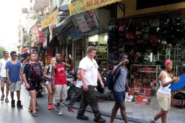 Foreign visitors at the Hanoi Old Quarter.
