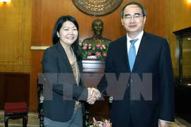VFF President Nguyen Thien Nhan (R) and Representative of UNFPA, Ritsu Nacken (Photo: VNA)