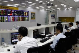 Most of the companies listed on the Hanoi Stock Exchange report positive results (Photo: VNA)