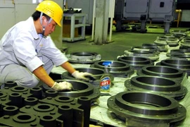 A worker inspects equipment at a foreign-invested company in the northern port city of Hai Phong (Photo: VNA)