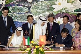 The signing ceremony (Source: VNA)