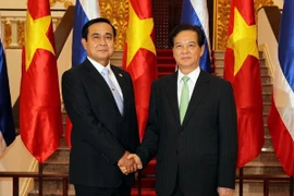 PM Nguyen Tan Dung and Thai PM Prayuth Chan-ocha (Photo: VNA)