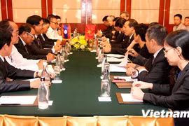 The working session in Laos on Sept. 24 (Photo: VNA)