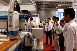 An pavilion in the 2011 Vietnam Woodworking Industry Fair (Photo: VNA)