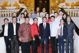 Deputy Prime Minister Vu Duc Dam and other delegates (Photo: VNA)