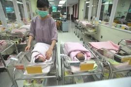 Measures to adjust birth rates will be flexible in different provinces and cities in the future so that localities can choose the most suitable measures for their situations, said experts from the General Office for Population and Family Planning.— Photo 