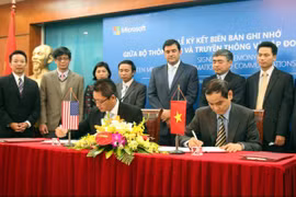 The signing ceremony (Source: VNA)