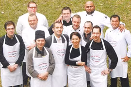 French Ambassador to Viet Nam Jean-Noel Poirier (first row, second left) and chefs participating the Gout de France pose for a photo shoot to promote this international gastronomy event. (Photo courtesy of the French Embassy)