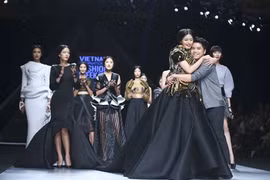 Fashion designer Ly Giam Tien, 18, winner of Project Runway 2014, showcased his collection during the Vietnam International Fashion Week (Photo: VNA)