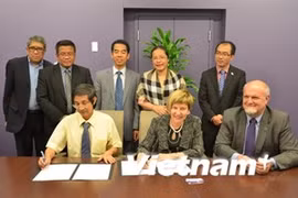 The signing ceremony (Photo: VNA)