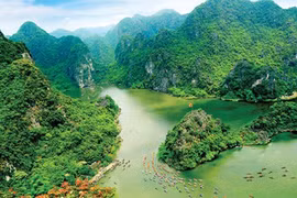 Trang An Scenic Landscape in Ninh Binh Province was named on UNESCO's World Heritage List in June 2014, the country's first site to be acknowledged as a mixed natural and cultural site (Photo: VNA)