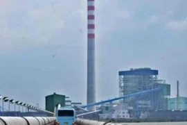 A bus travels near the Cirebon-1 coal-fired power plant on Oct. 18, 2020, in Cirebon, West Java. Indonesia, home to the world's fourth-biggest population, is one of world’s largest thermal coal exporters and carbon emitters. (Photo: Antara) 