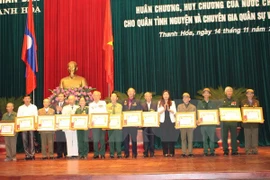 Laos honours Vietnamese voluntary soldiers, experts