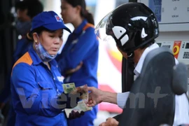 Petrol prices down over 720 VND per litre