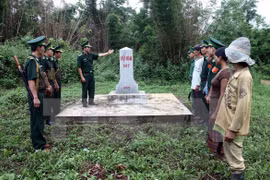 Vietnam, Laos review border cooperation