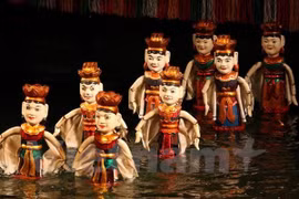 Artisan dedicates to water puppet making