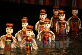 Artisan dedicates to water puppet making