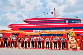 Representatives from agencies and companies at the launching ceremony of the high-speed boat service linking HCM City and Con Dao island. (Photo: plo.vn)