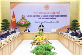 Prime Minister Pham Minh Chinh on December 7 meets with ambassadors and heads of Vietnam's representative offices abroad before they take on their new assignments. (Photo: VNA)