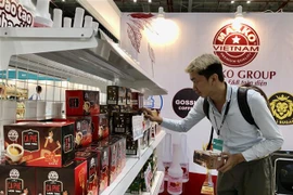 A consumer visit a booth at the Vietnam International Cafe' Show 2024. (Photo: VNA)