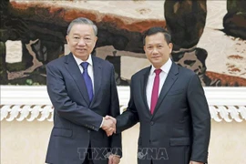 President To Lam (left) and Cambodian Prime Minister Samdech Moha Bovor Thipadei Hun Manet. (Photo: VNA) 