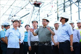 Prime Minister Pham Minh Chinh examines the construction of Terminal T3 of Tan Son Nhat International Airport in Ho Chi Minh City on August 10. (Photo: VNA)