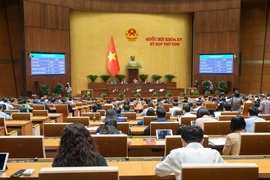 The 15th National Assembly (NA) adopts the Law on amendments and supplementations to a number of articles of nine laws on November 29. (Photo: quochoi.vn)