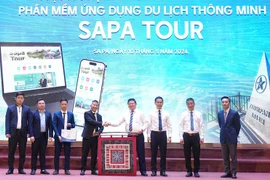 Representatives from agencies are at the launching ceremony of the app "Sapa Tour" to promote tourism in resort town of Sa Pa in northern province of Lao Cai. (Photo: nhandan.vn)